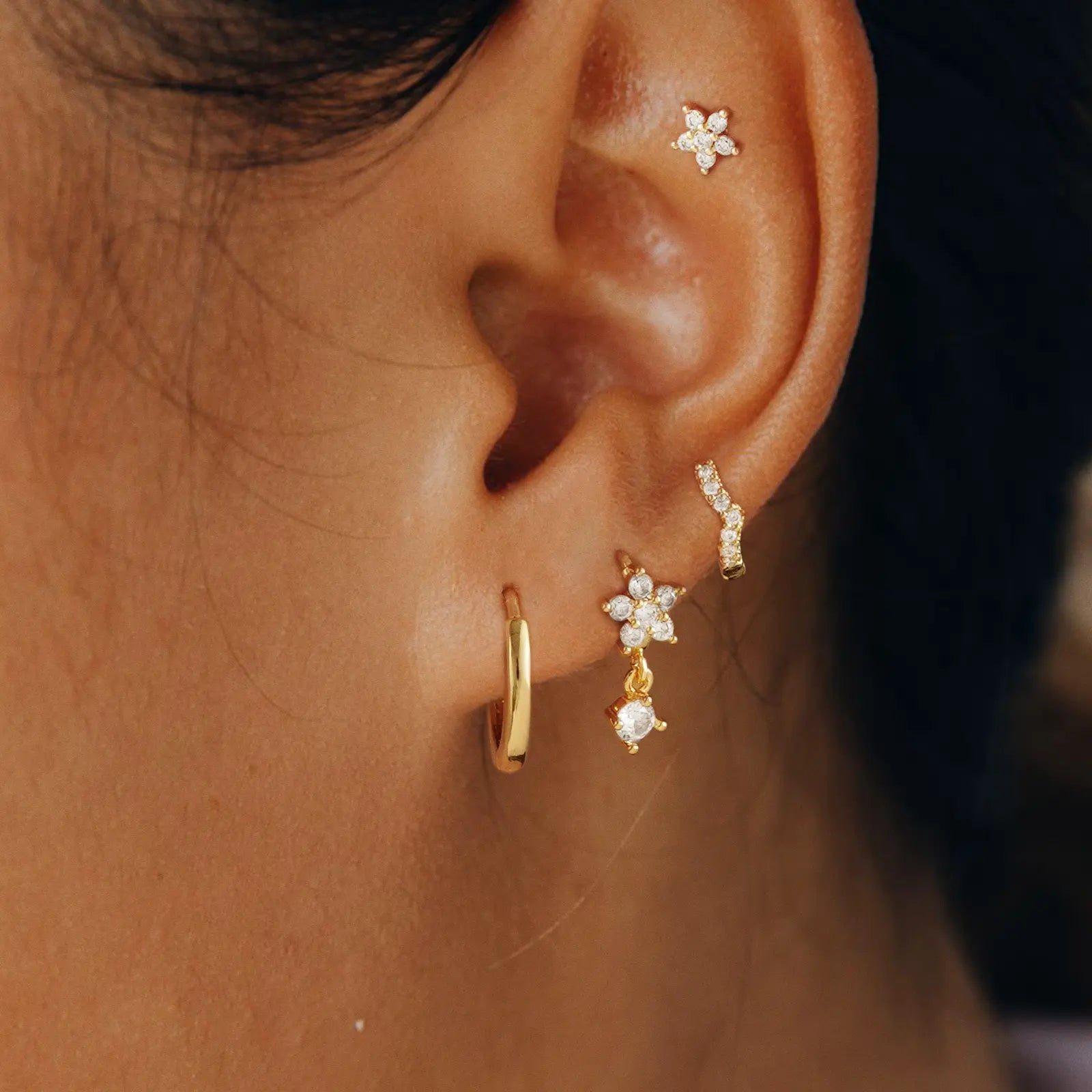 Women wearing kyerlyn diamond gold hoop earrings