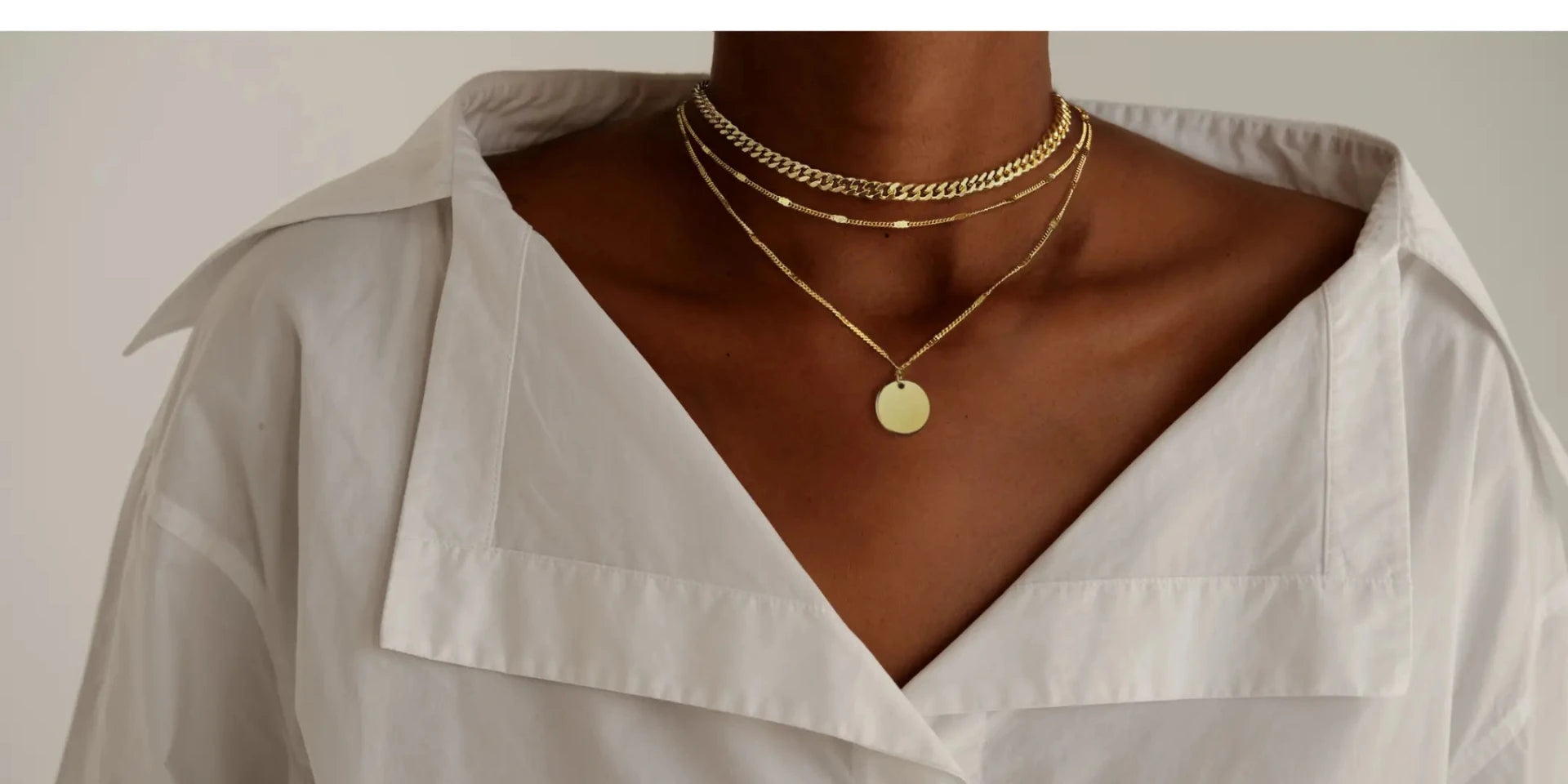 Black Women Wearing Kyerlyn Layered Pendant Gold Necklace