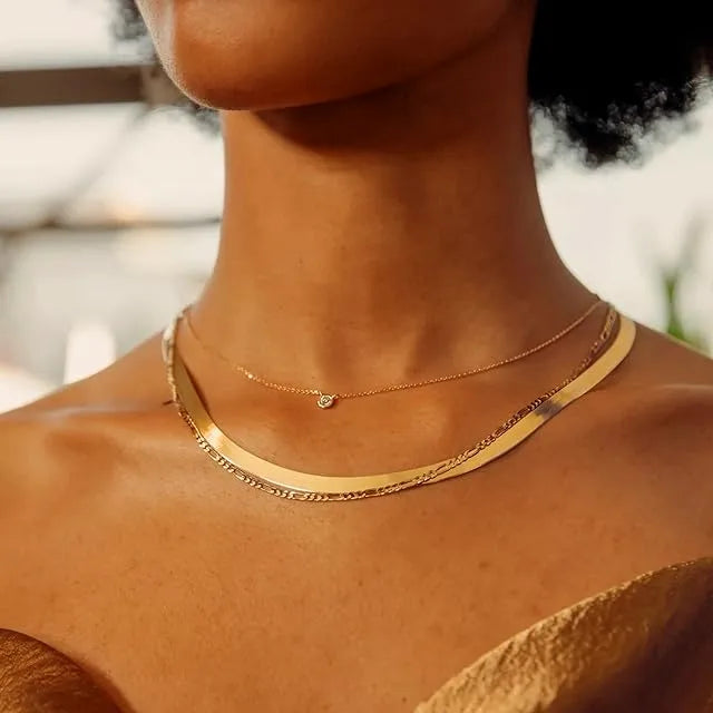 Women wearing kyerlyn diamond layered gold necklaces