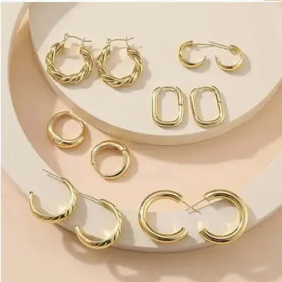 Collection of stylish gold earrings, showcasing women's earrings jewelry.