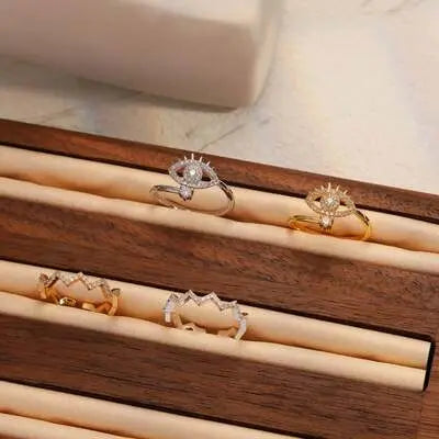 Collection of gold and silver rings with intricate designs, showcasing women's ring jewelry.