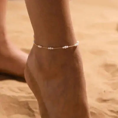 Delicate anklet with beads, highlighting women's ankle jewelry.