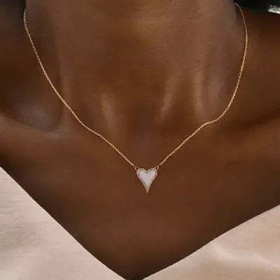 Delicate gold necklace with heart pendant, showcasing women's necklace jewelry.